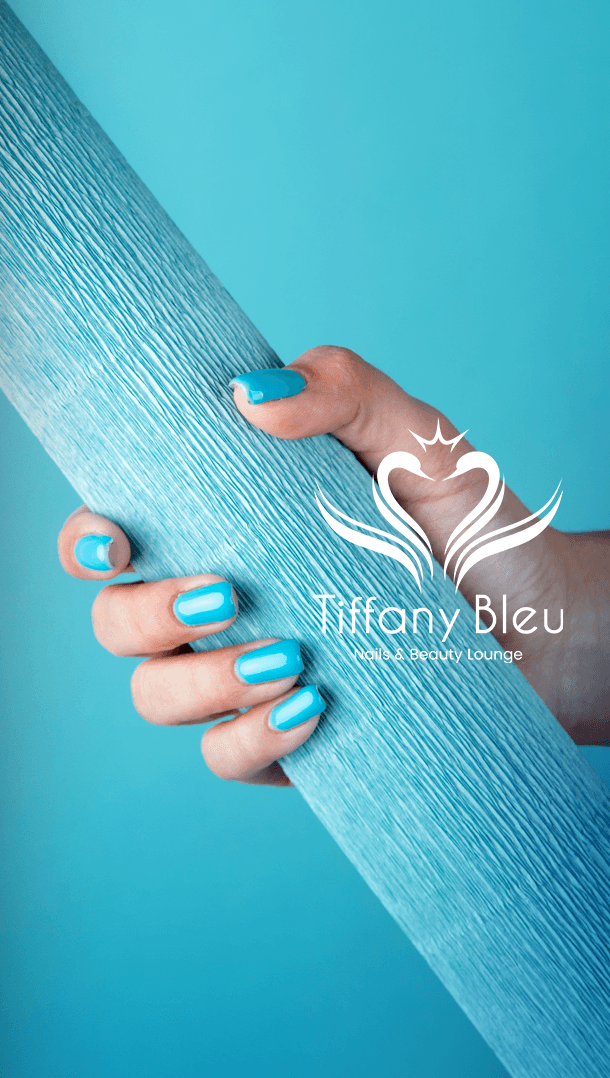 Bright teal manicure holding a blue textured prop